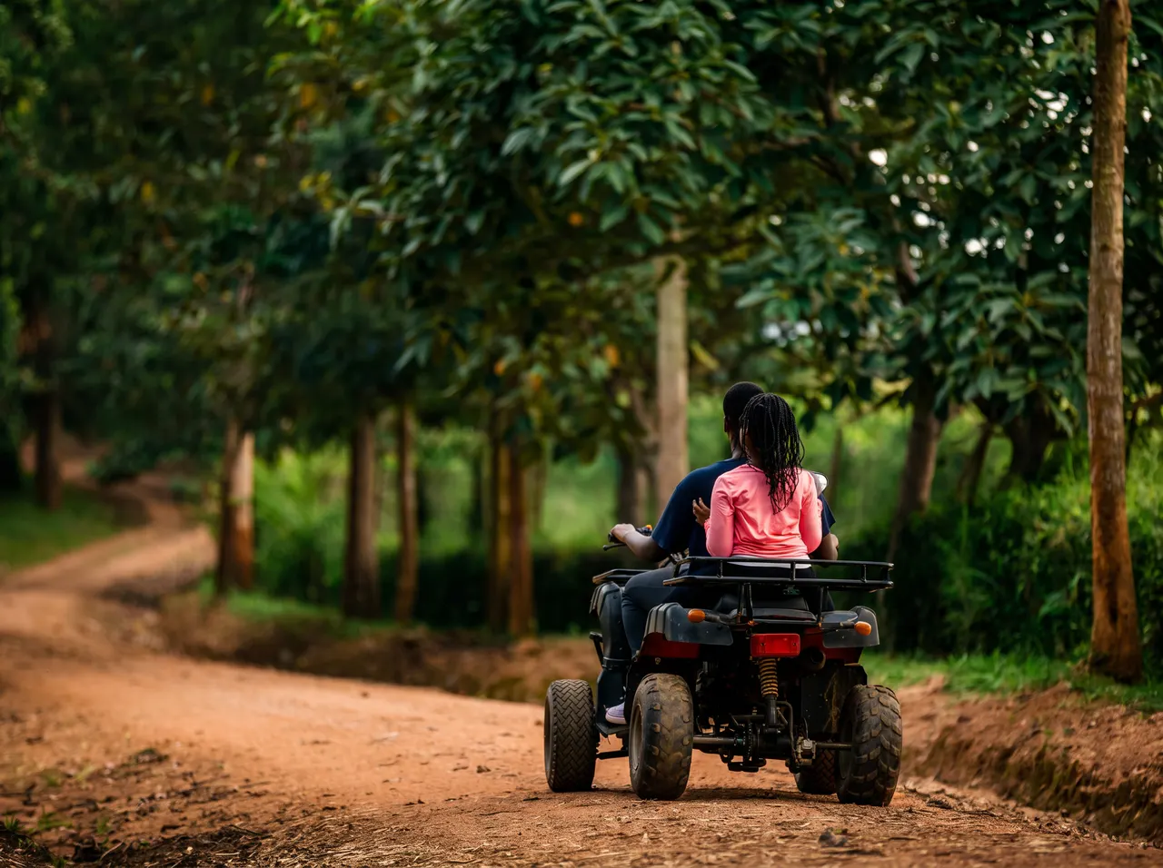Guests enjoying a guided quad-bike ride on a countryside trail.
