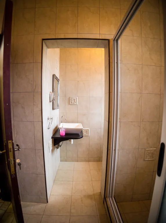 Elite bathroom vanity and shower area.