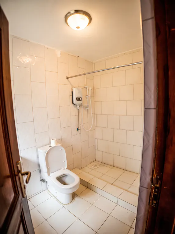 Royal tiled bathroom with a walk-in shower.
